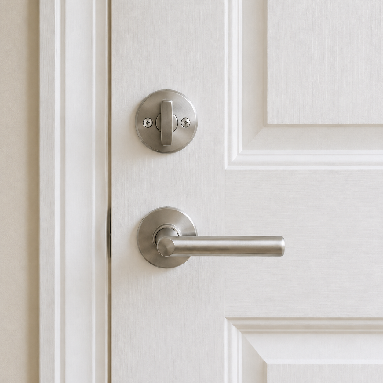 Inside fitting with an upright satin-silver thumbturn and matching handle
