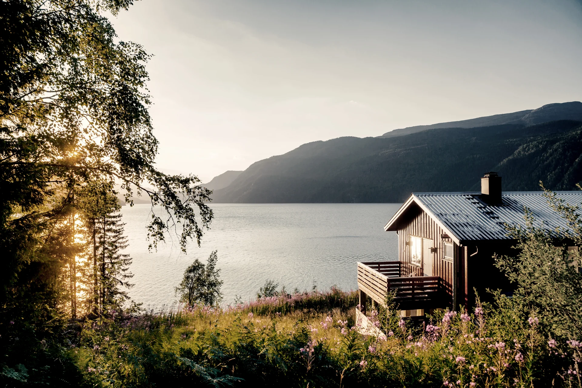 Norwegian cabin beside a mountain lake